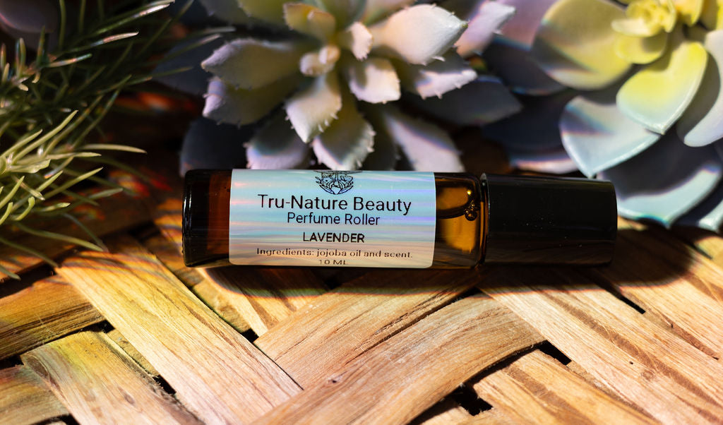 Tru-Nature Beauty lavender perfume roller with succulent plants in the background