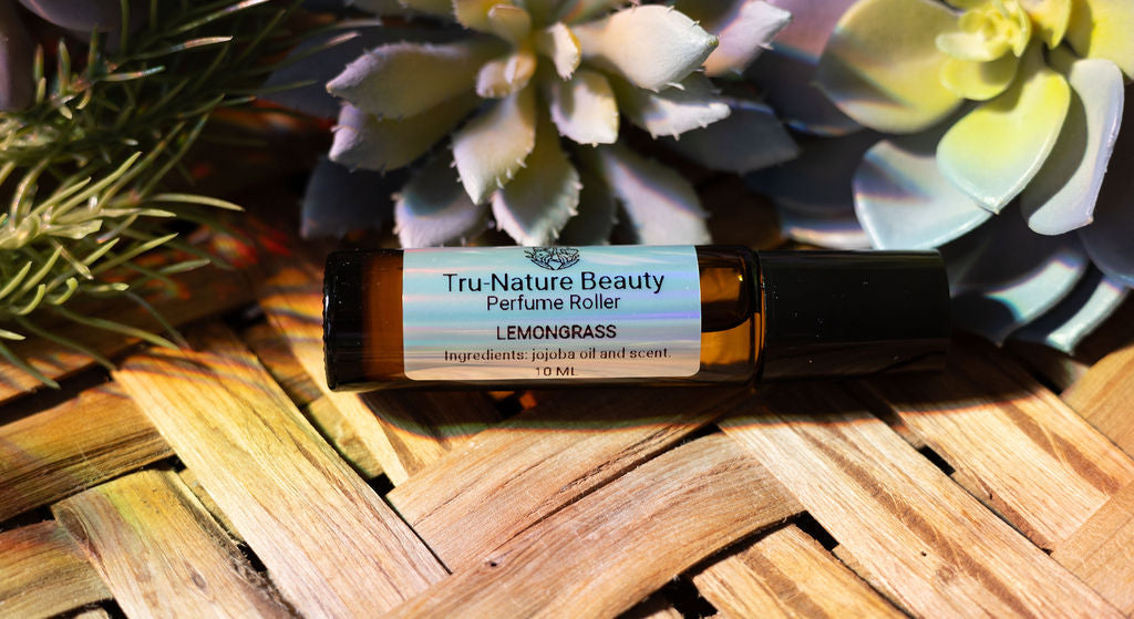 Tru Nature Beauty Lemongrass perfume roller on a woven surface with succulents in the background