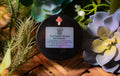 Tru-Nature Beauty dry shampoo container with a label on a decorative background of plants.