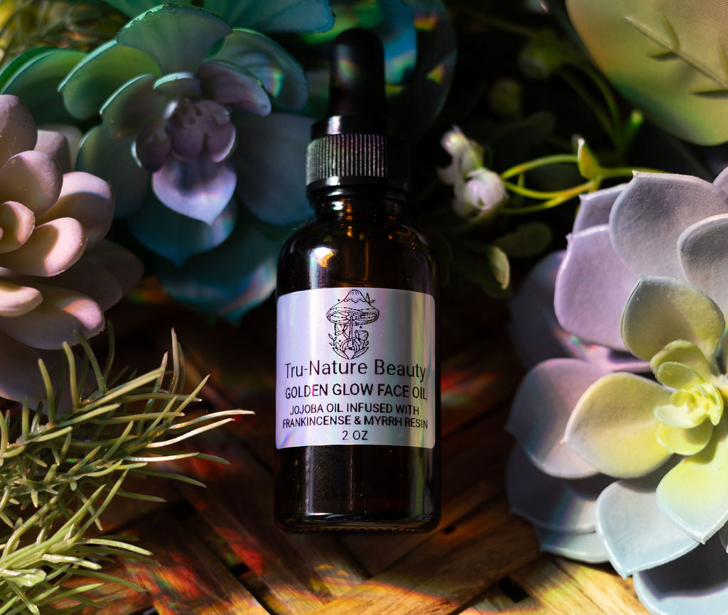 Bottle of Tru-Nature Beautiful Golden Glow Face Oil surrounded by succulent plants