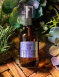 Brown glass bottle of Tru Nature Beauty magnesium spray with a label on a wooden surface with greenery.