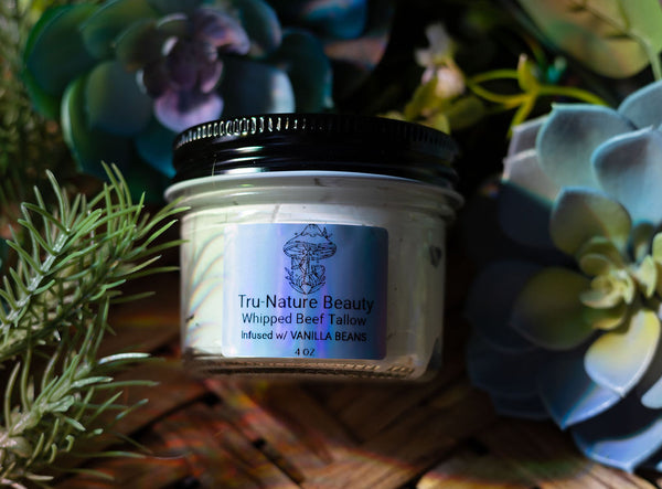 Jar of Tru-Nature Beauty whipped beef tallow with plants in the background